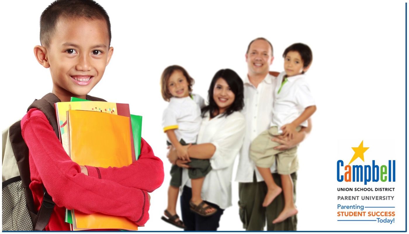 smiling student with family behind him