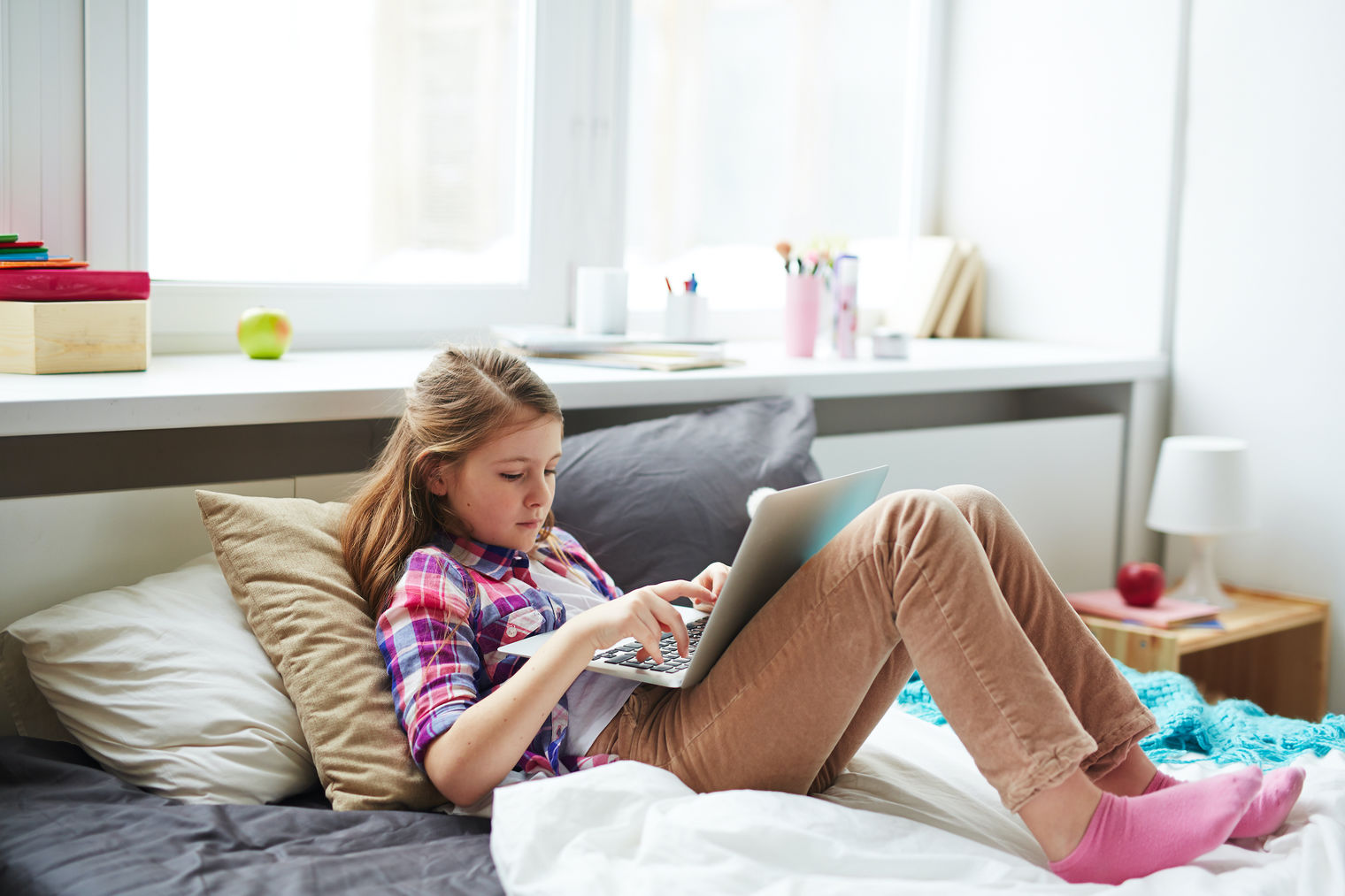 girl playing a game on laptop