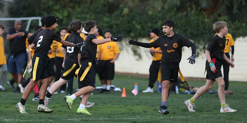 Students playing flag football