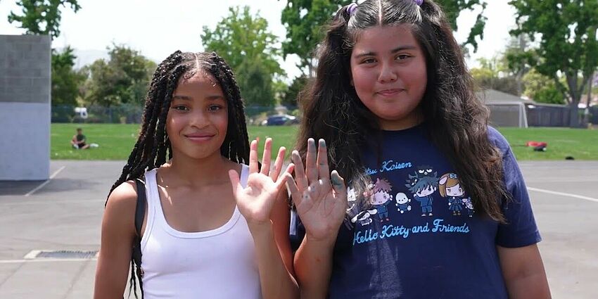 Students holding hands on playground