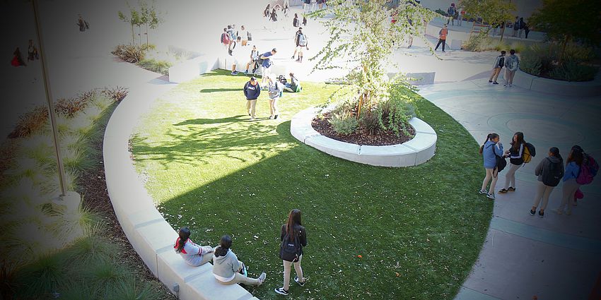 view from 2nd story of students on campus
