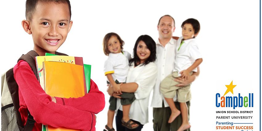 smiling student with family behind him