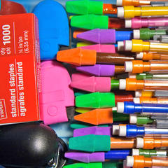 bundles of pencils, erasers and school supplies