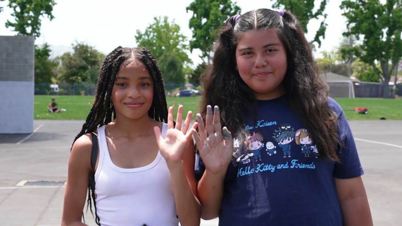 Students holding hands on playground