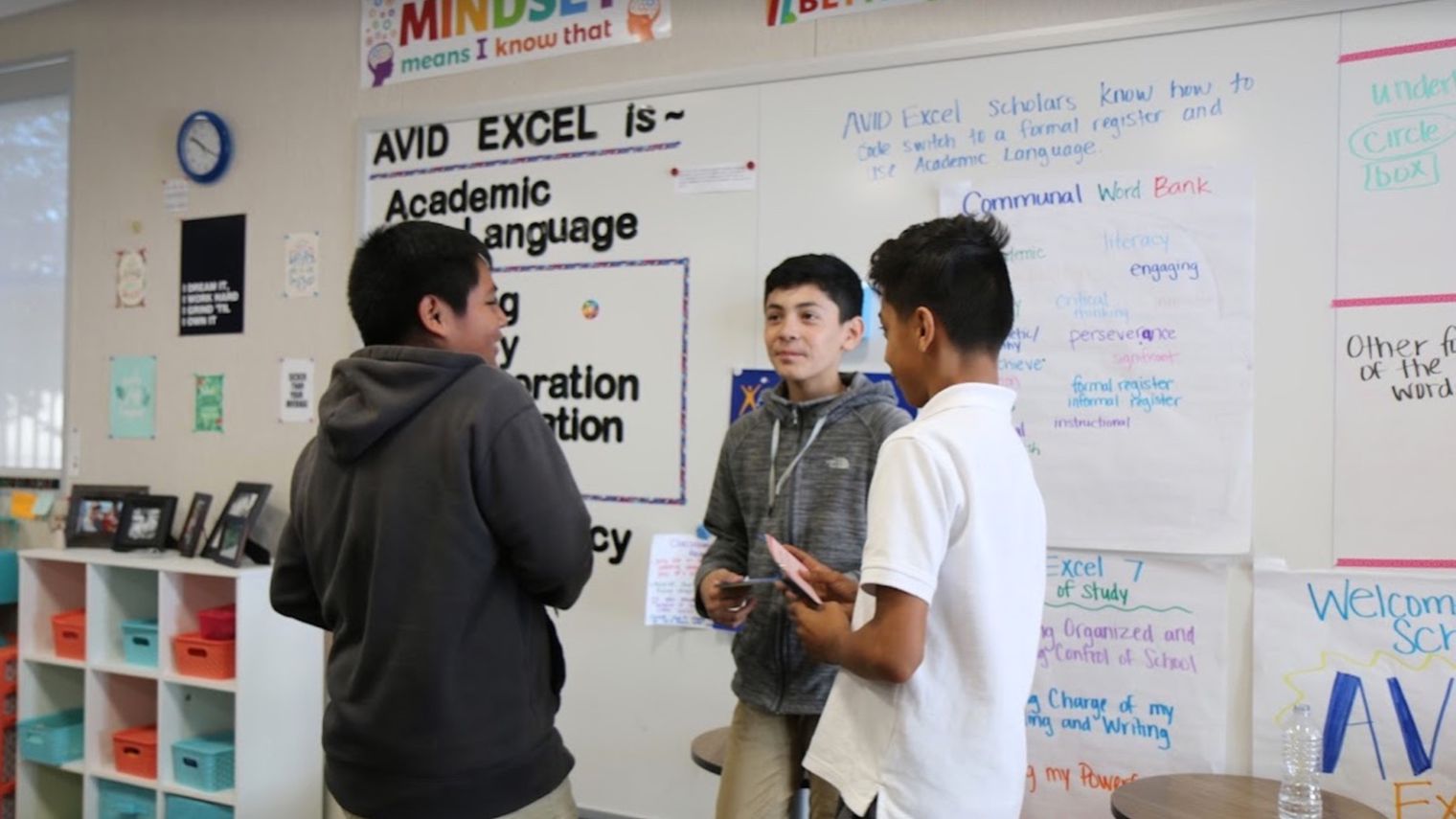 three male students working in a group
